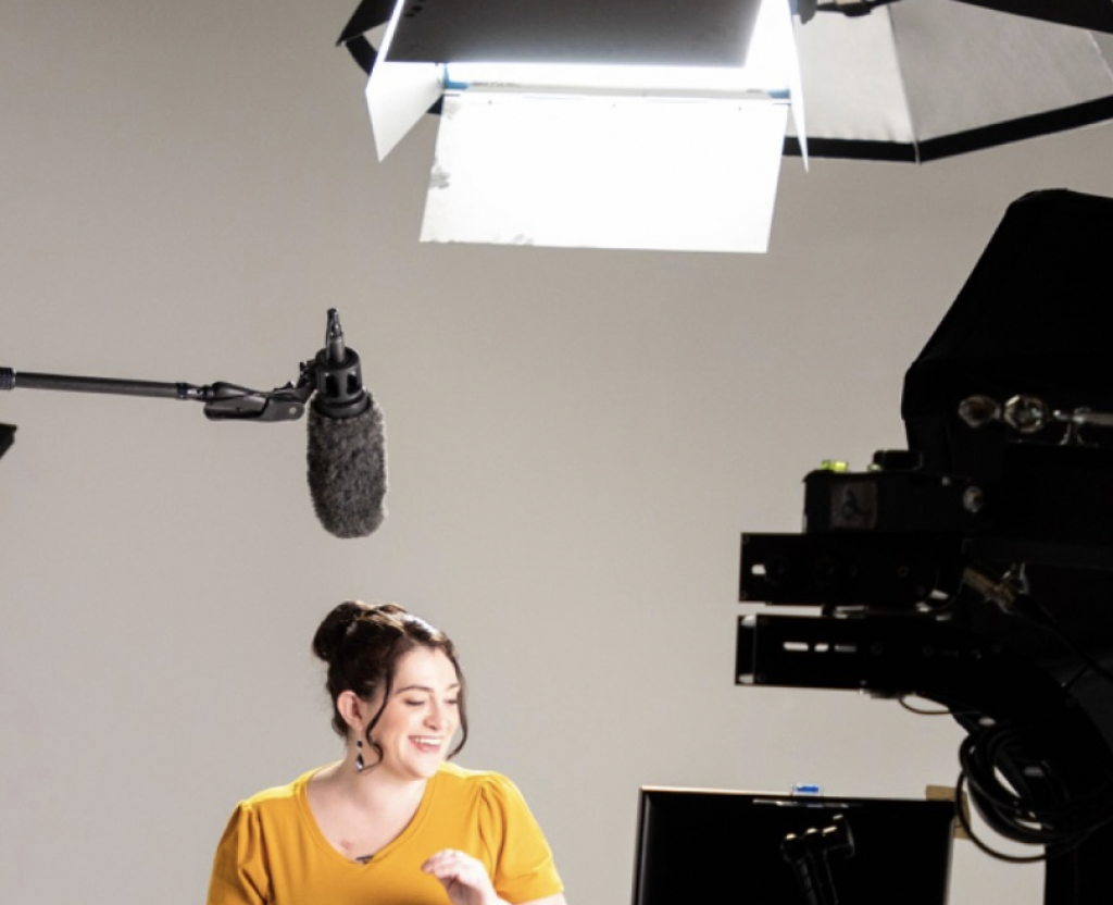 Speaker at filming studio with professional lighting